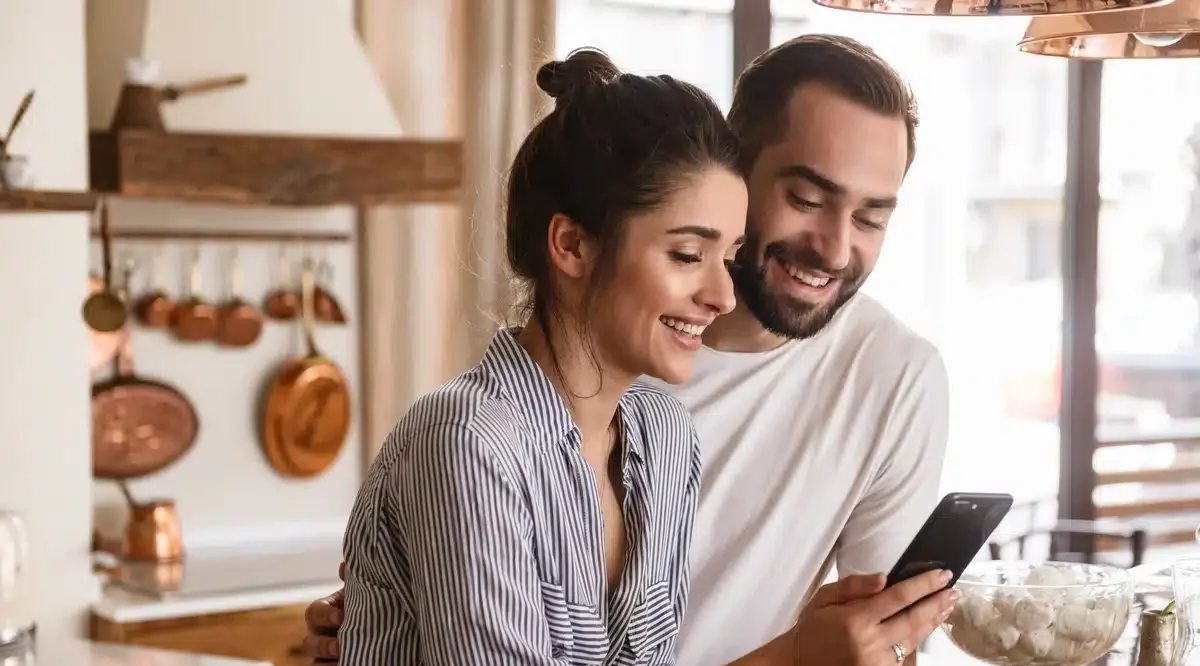 couple at home calls and asks contractor roofing questions