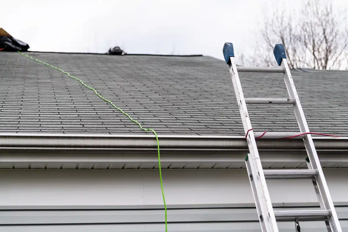 close up of ladder leading to rooftop during inspection and possible roof scam